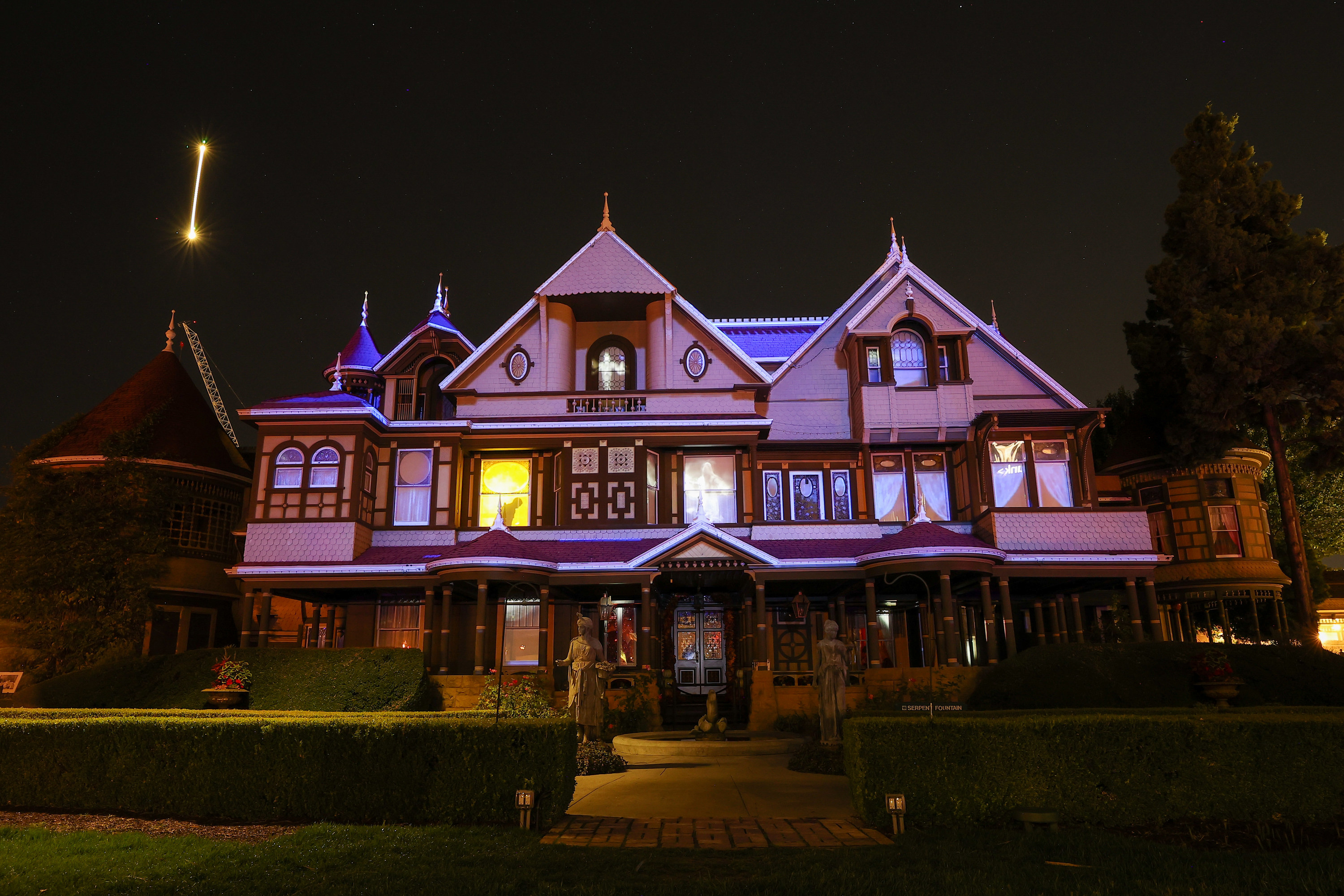 Old house lit up at night