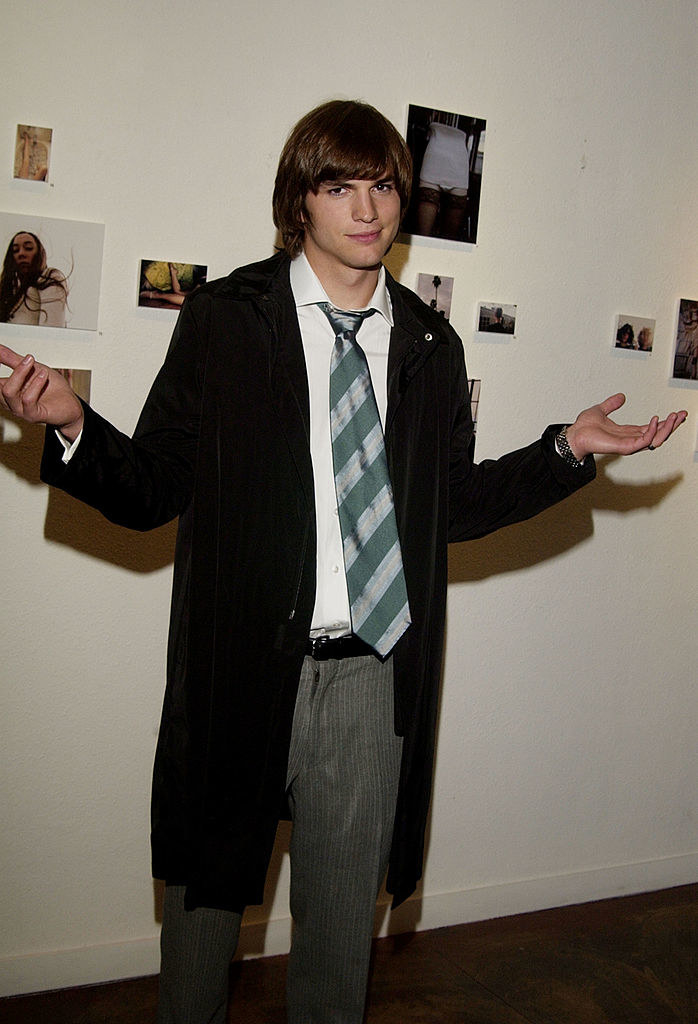Ashton Kutcher throwing his hands up