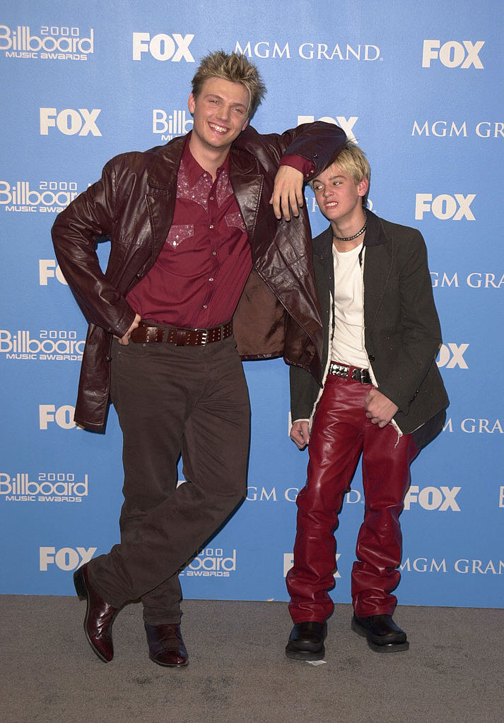 Nick Carter using Aaron Carter as a leaning post