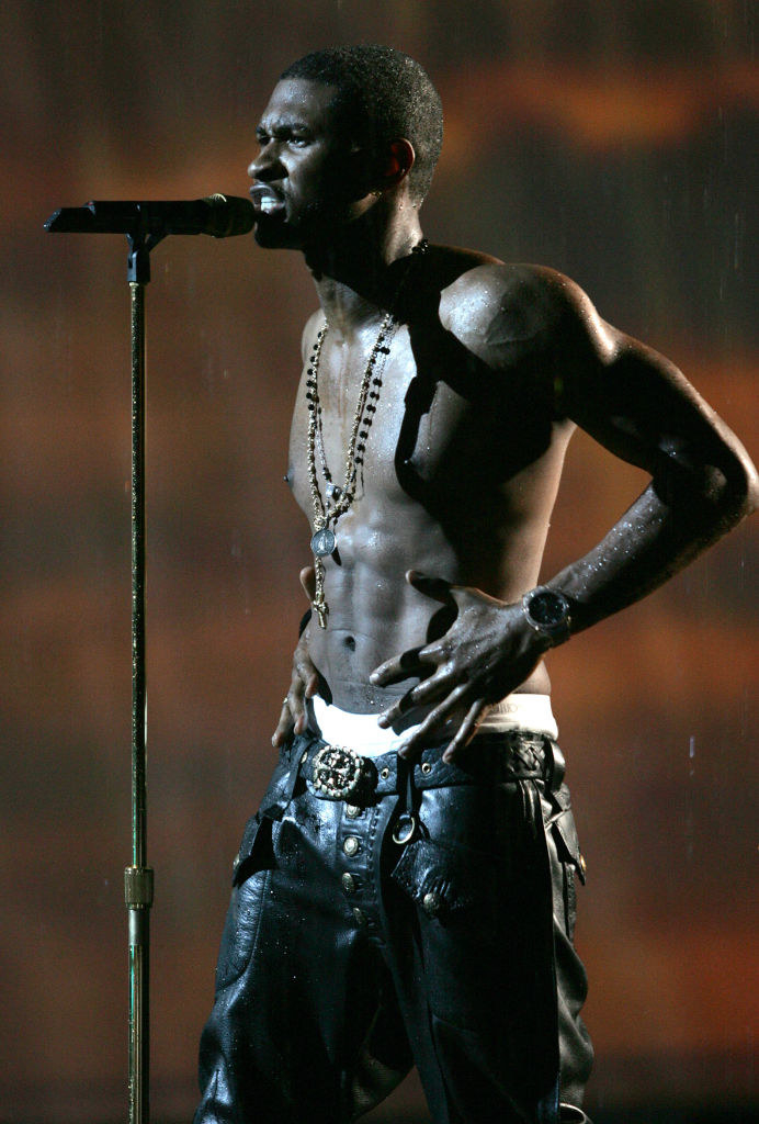 Usher performing onstage