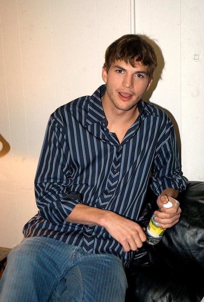 Ashton Kutcher sitting with his mouth open