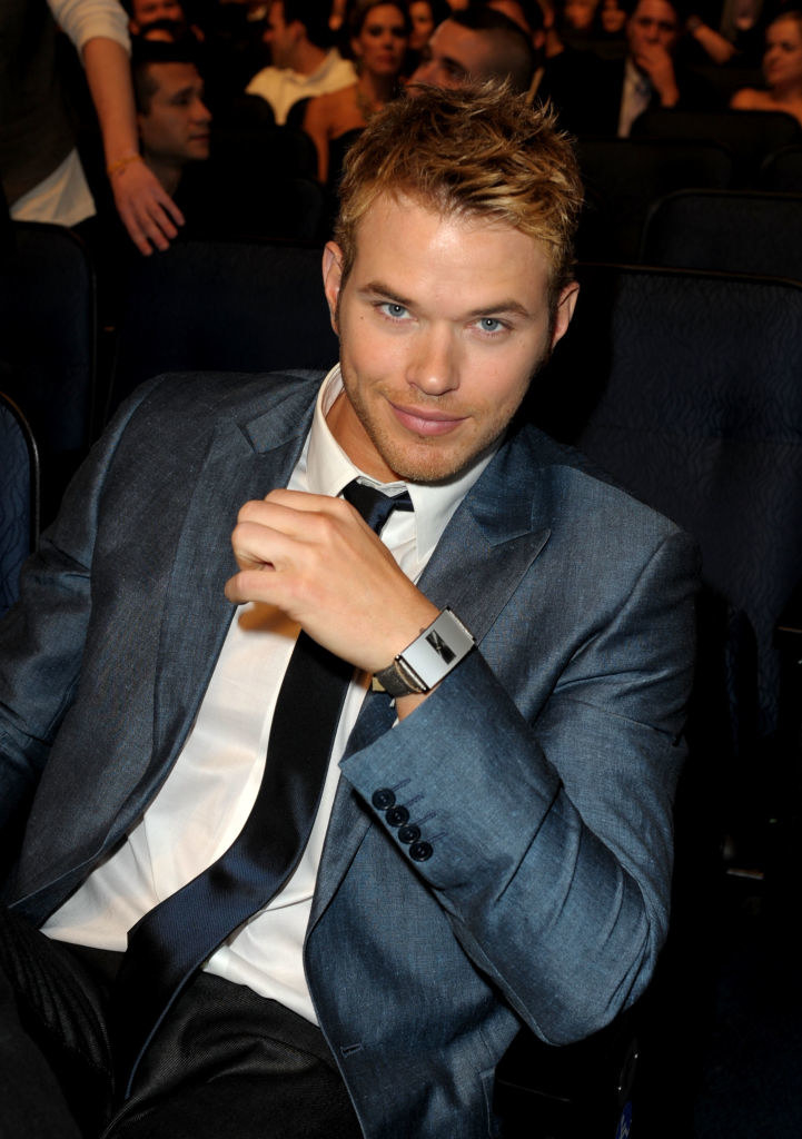 Kellan Lutz sitting and smiling