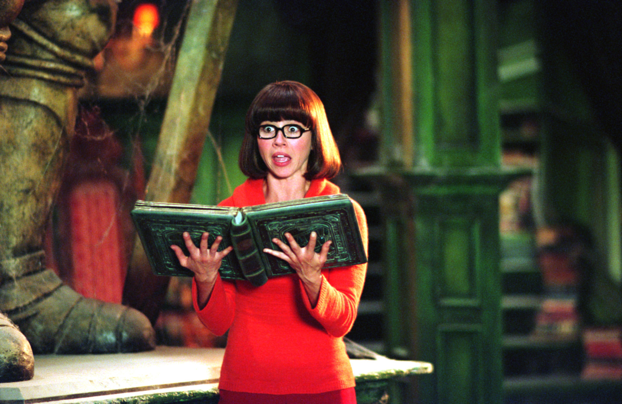 Velma holding a book in the live-action film