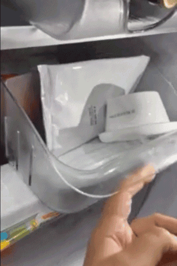 Reviewer pulls the bin out of the fridge with just one finger