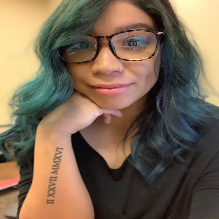 reviewer wearing leopard-print blue-light blocking glasses