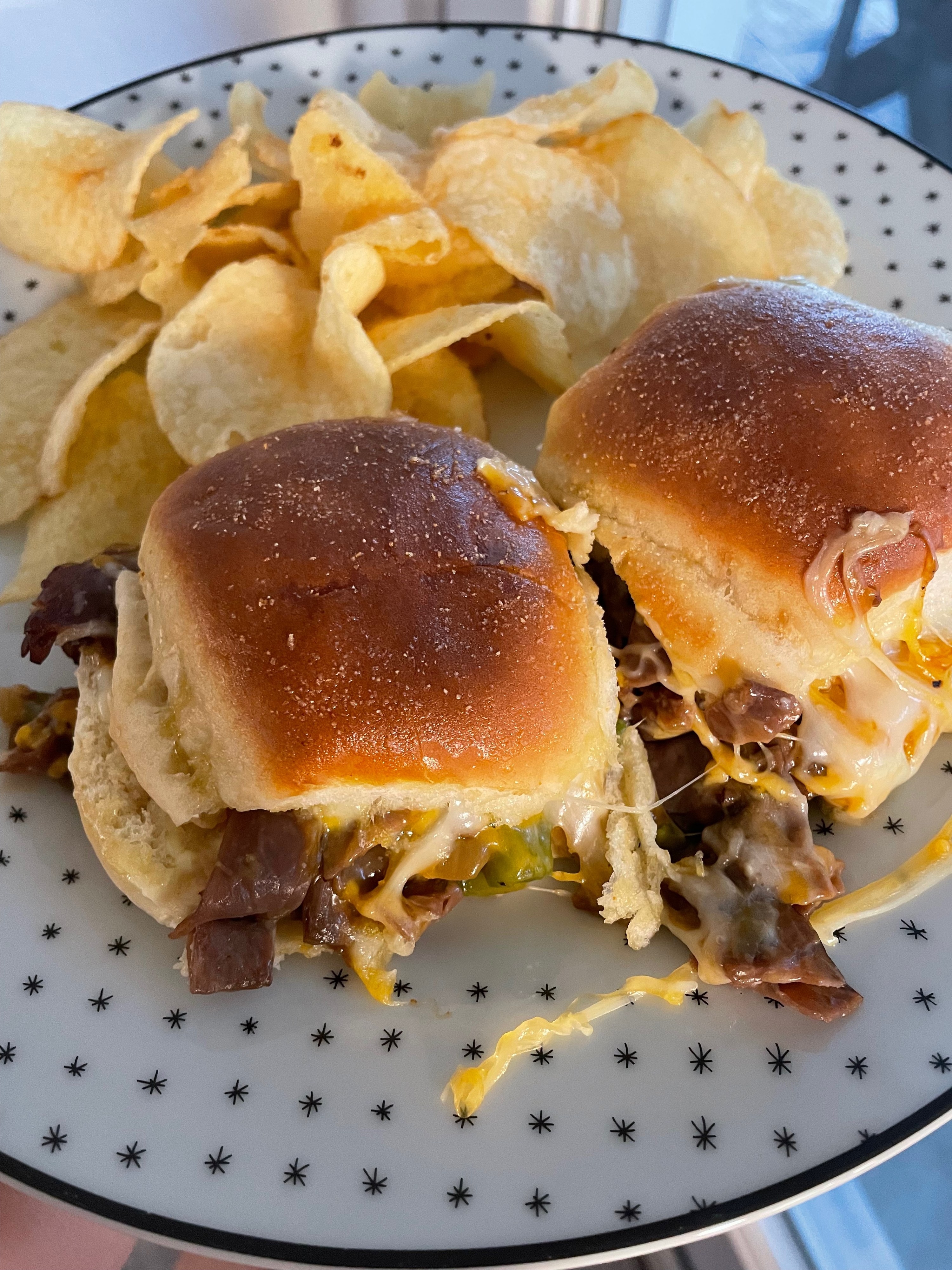 Philly cheesesteak sliders on a plate