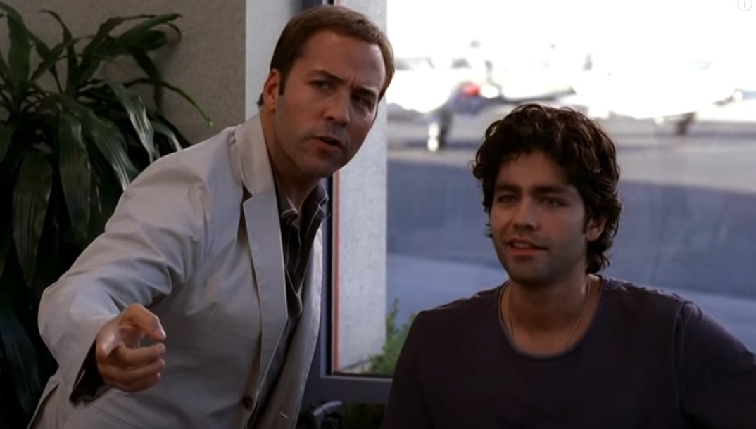 Jeremy Piven as Ari Gold and Adrian Grenier as Vincent Chase looking at somebody