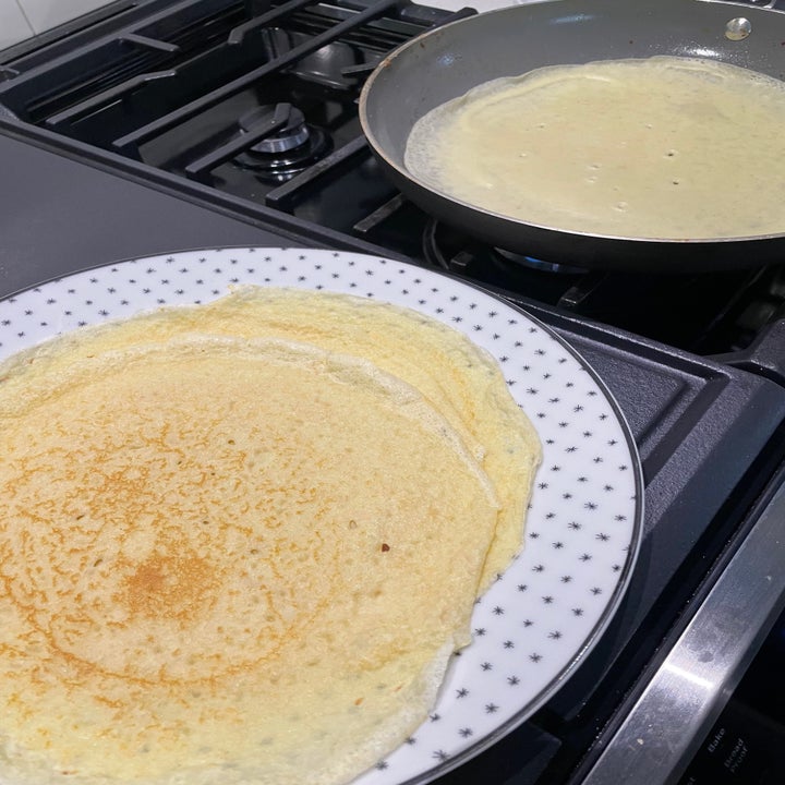 crepes cooking in a pan