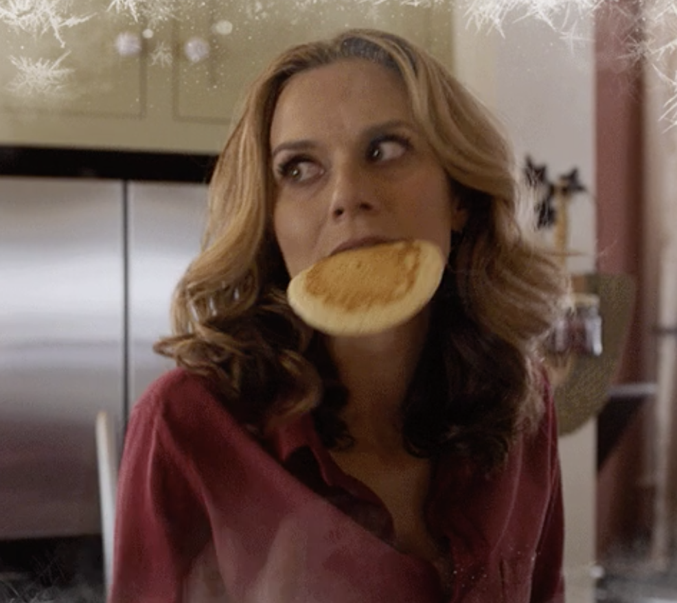 a woman eating a pancake