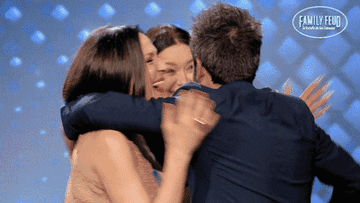 People hugging and celebrating on the show