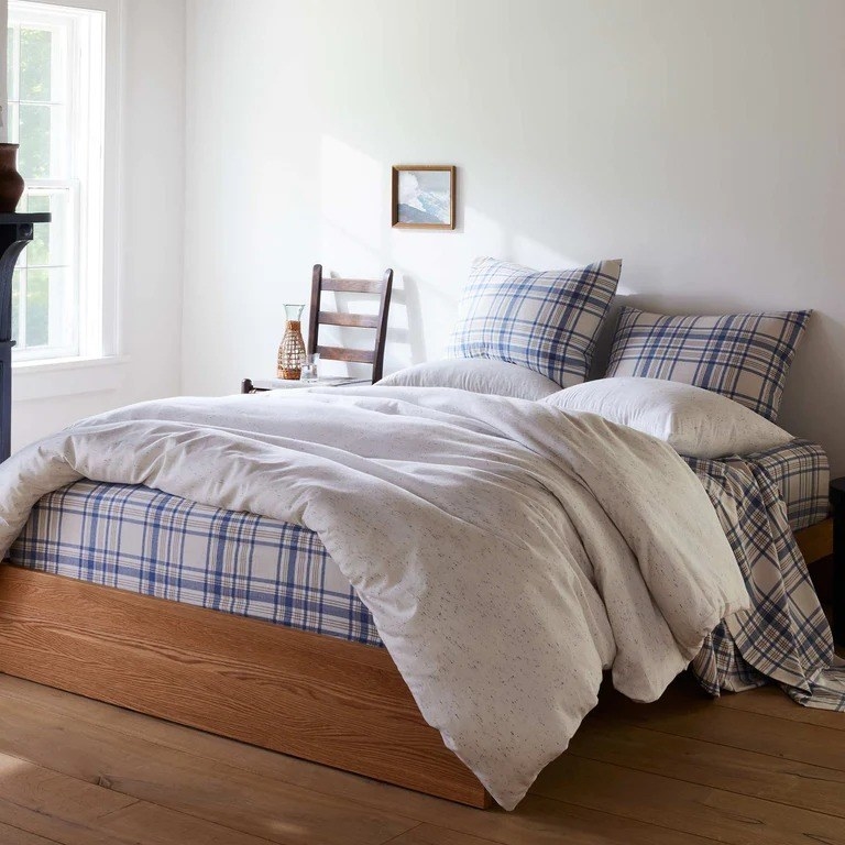the blue plaid sheets on a bed