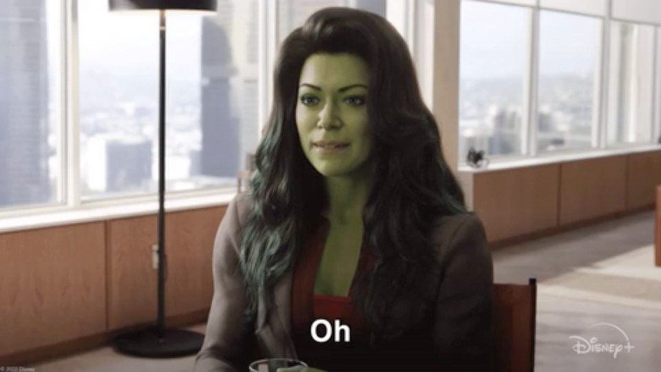 Jennifer in a suit transitioning into She-Hulk with green skin