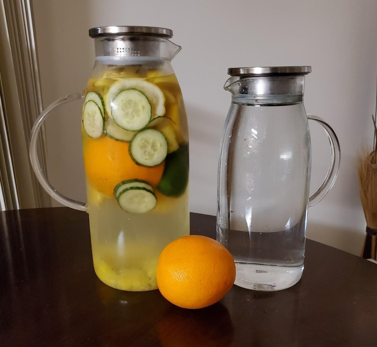 Reviewer has two differently sized glass pitchers filled with water