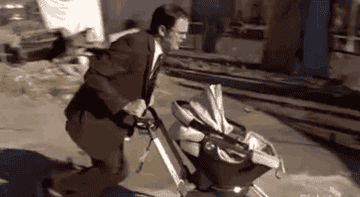 Dwight Schrute from &quot;The Office&quot; trying to destroy a stroller
