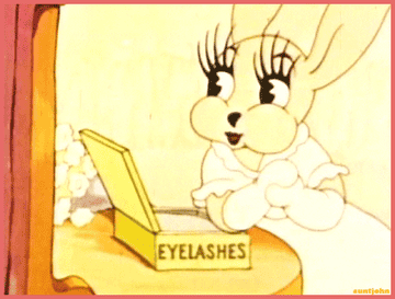 a gif of a bunny from bunny mooning flapping their extra long eyelashes