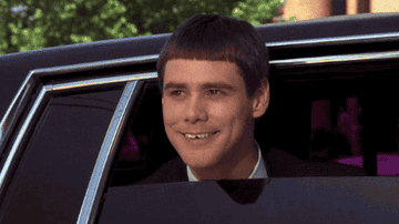 Jim Carrey leaning out of a car and saying &quot;That&#x27;s a lovely accent you have&quot;