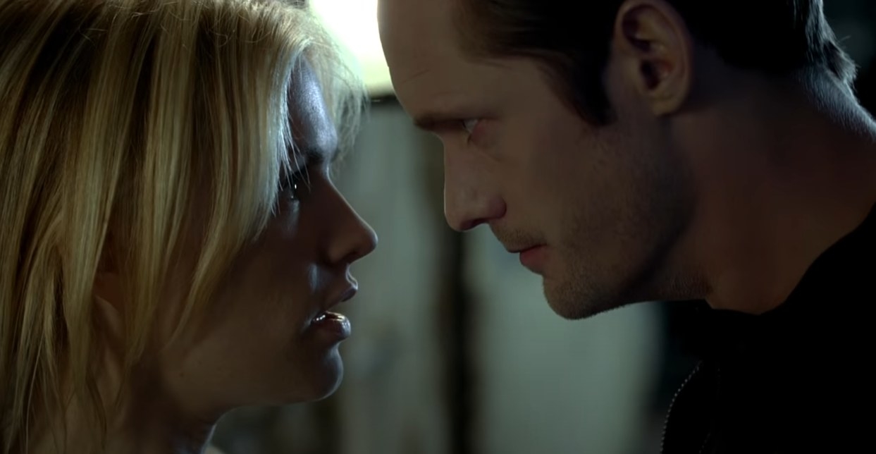Anna Paquin as Sookie and Alexander Skarsgård as Eric looking straight into each others eyes