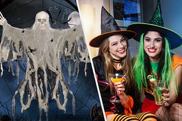 Hanging skeleton ghost decoration vs two girls holding drinks in witches costumes smile at party