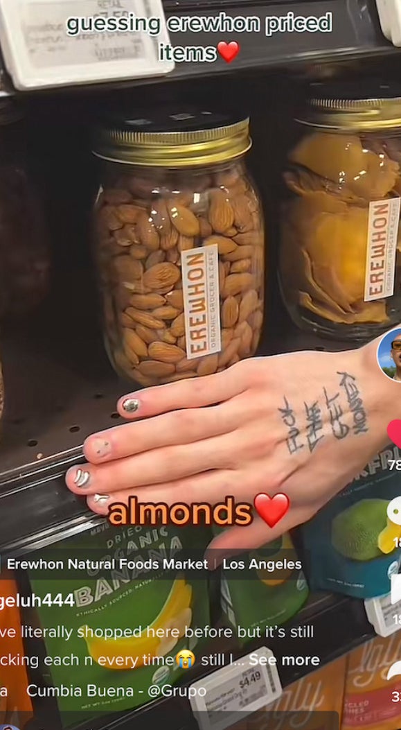 Guessing Erewhon price items TikZTok with hand over price tag for a jar of almonds