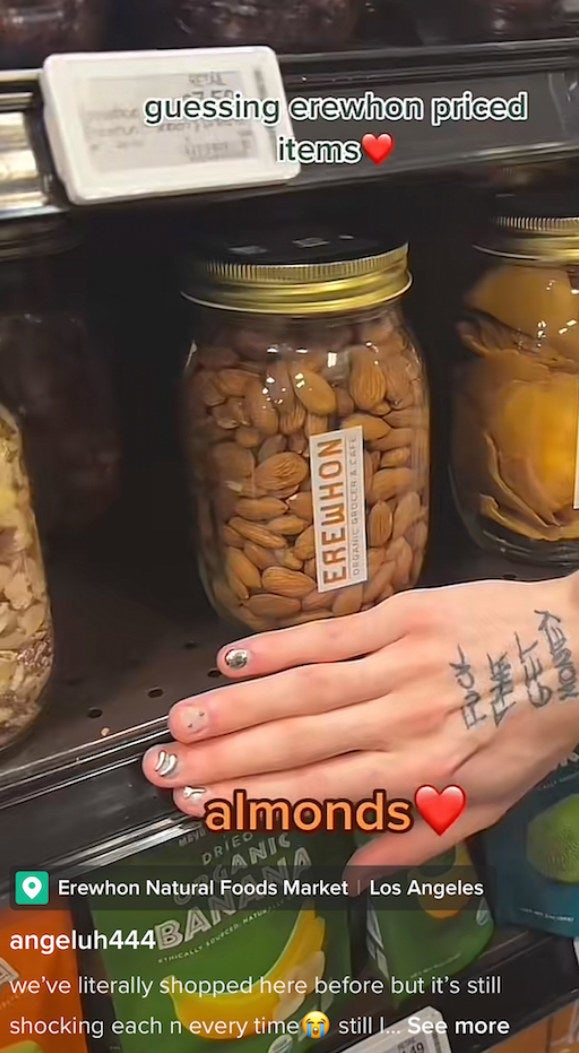 Guessing Erewhon price items TikZTok with hand over price tag for a jar of almonds