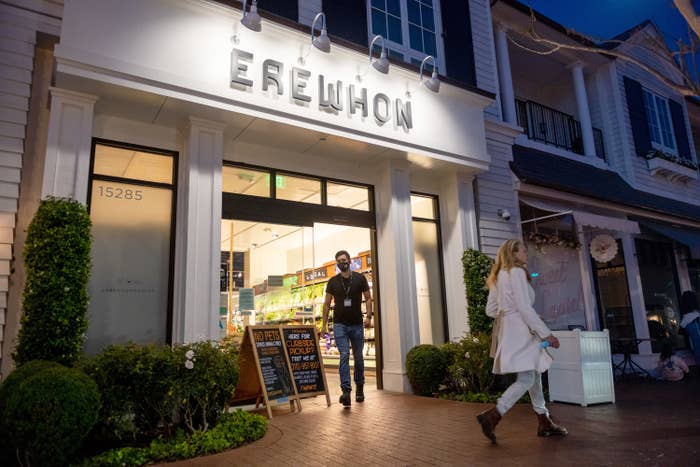 Lit Erewhon sign from outside the business at night