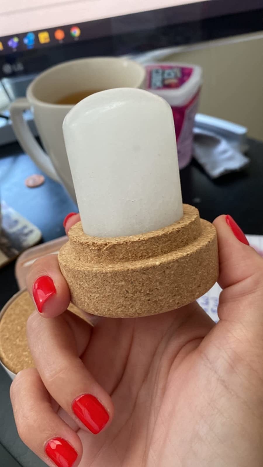 Reviewer holding the crystal deodorant stone