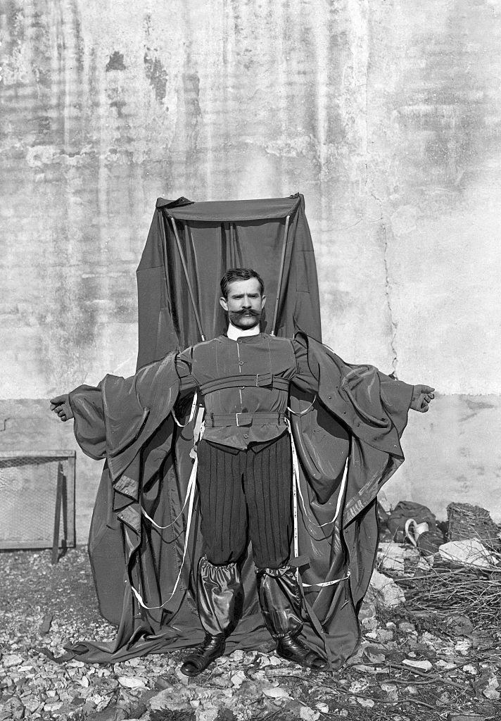 Reichelt wearing the parachute he designed