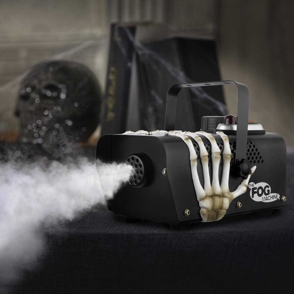Black fog machine with skull hand releasing fog