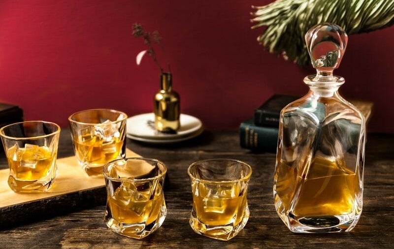 A whiskey decanter and four glasses
