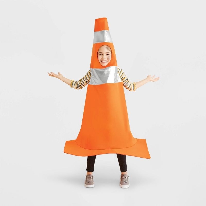 kid wearing cone costume