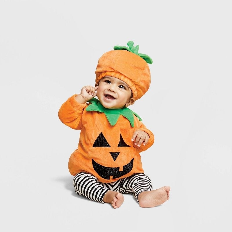 baby in pumpkin costume