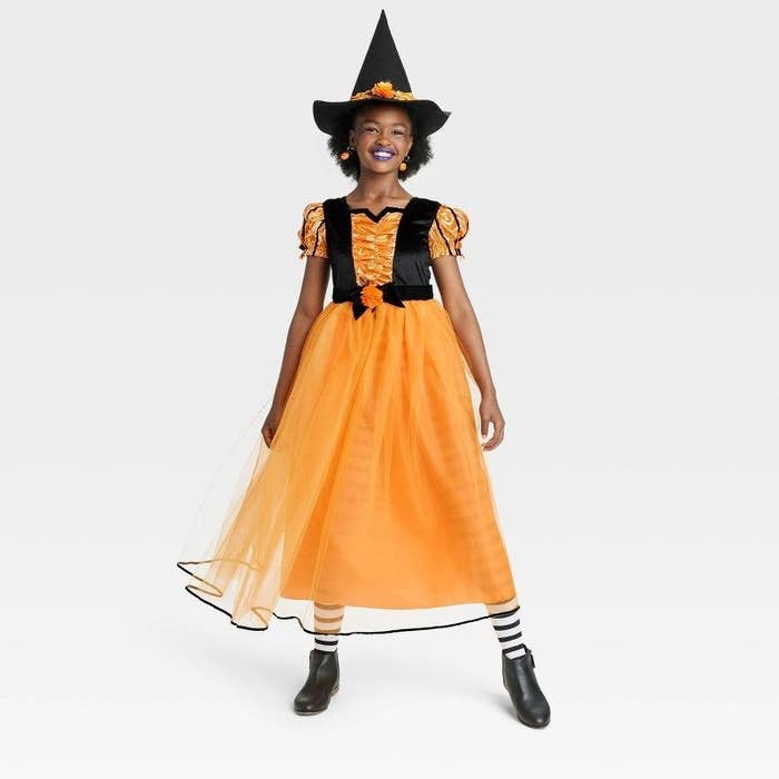 kid in the witch costume