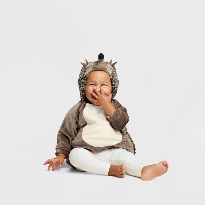 baby in hedgehog costume