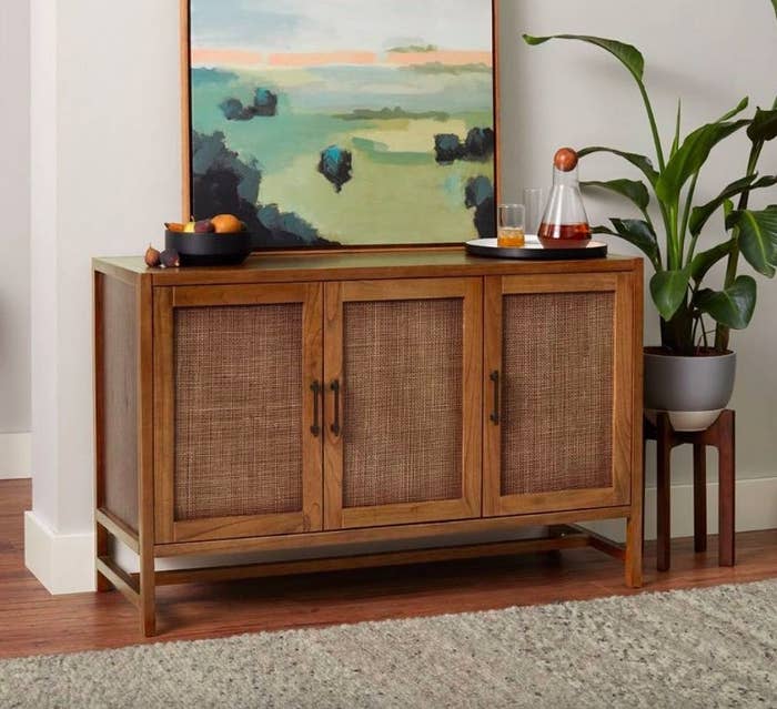 The TV stand with a painting on top