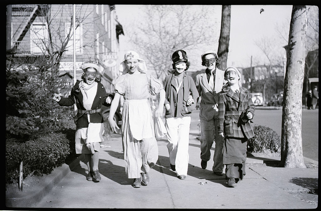 A group of trick-or-treaters