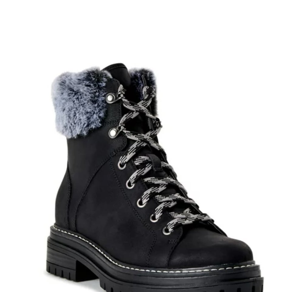 Black hiking boot with white and black laces, gray faux fur ankle cuff
