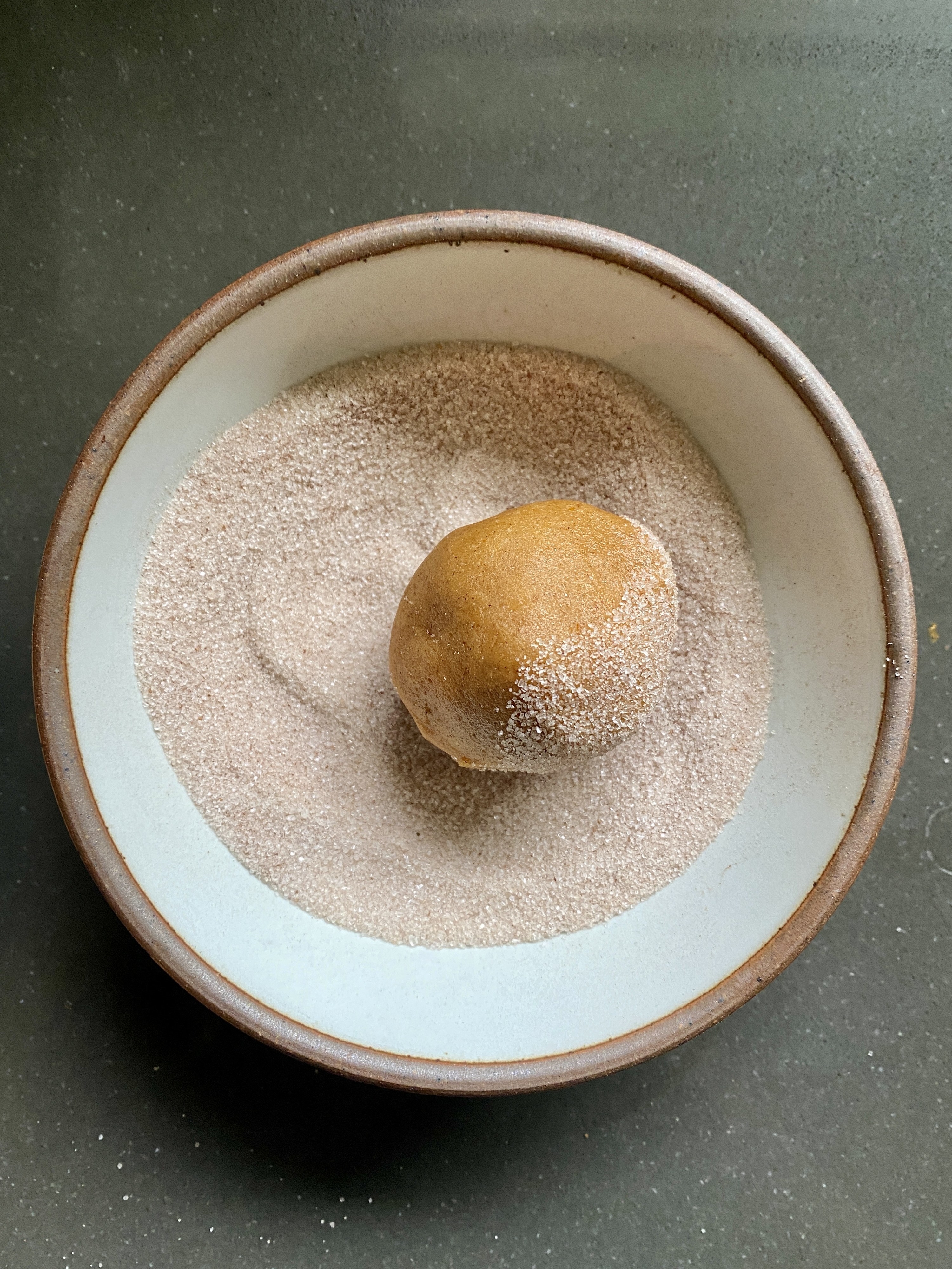 Rolling cookie dough in sugar