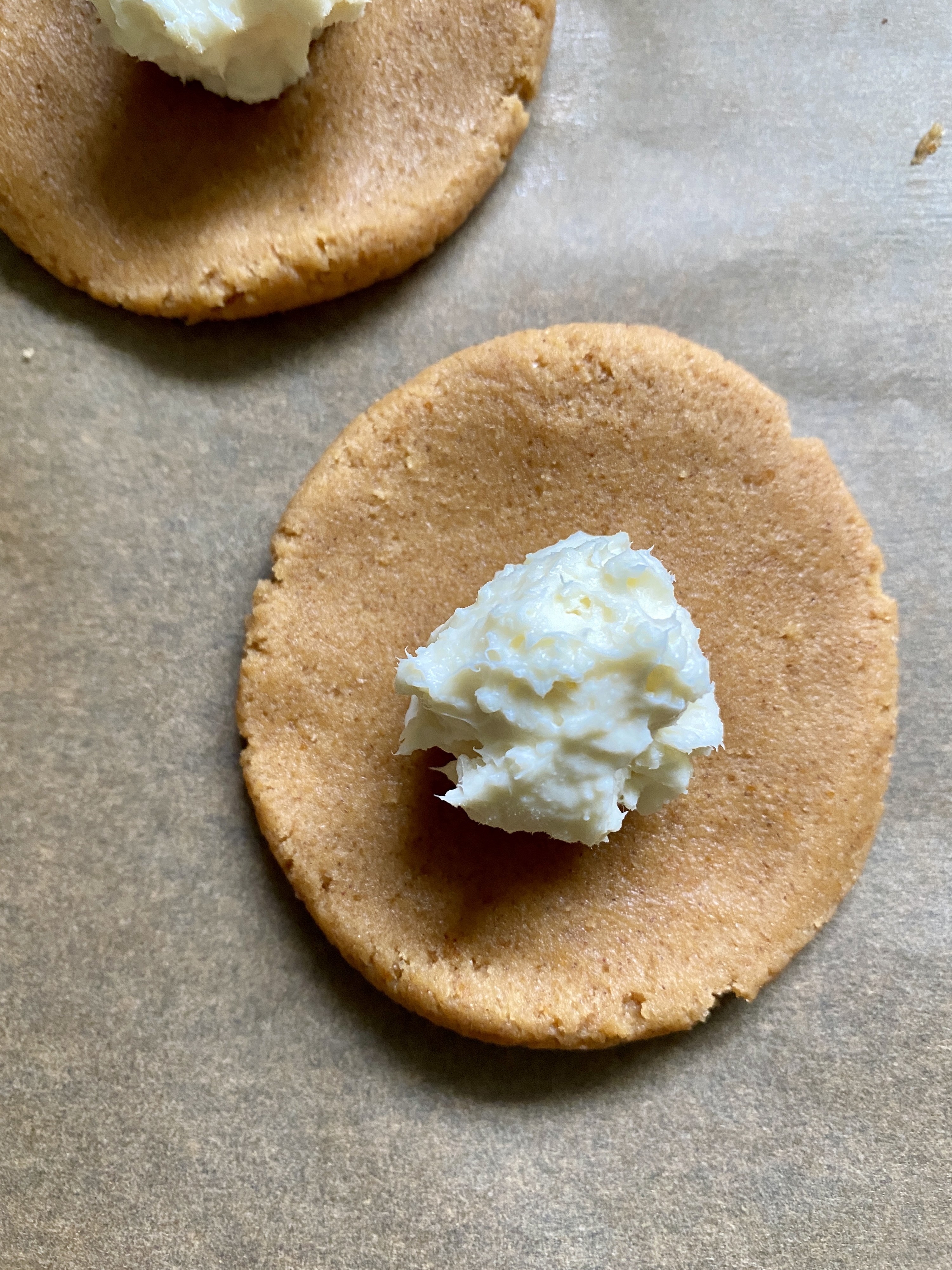 Placing cream cheese ball on cookie dough