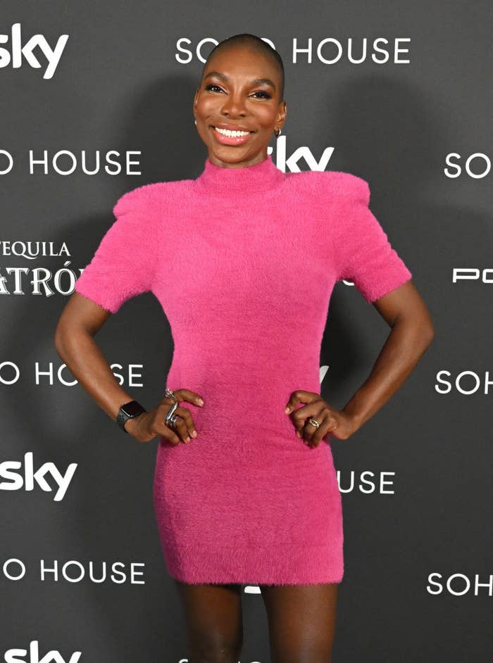 Michaela smiles as she poses for photographers on the red carpet