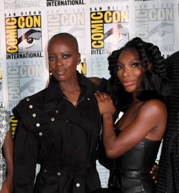 Florence Kasumba and Michaela pose for a photo along with others at ComicCon