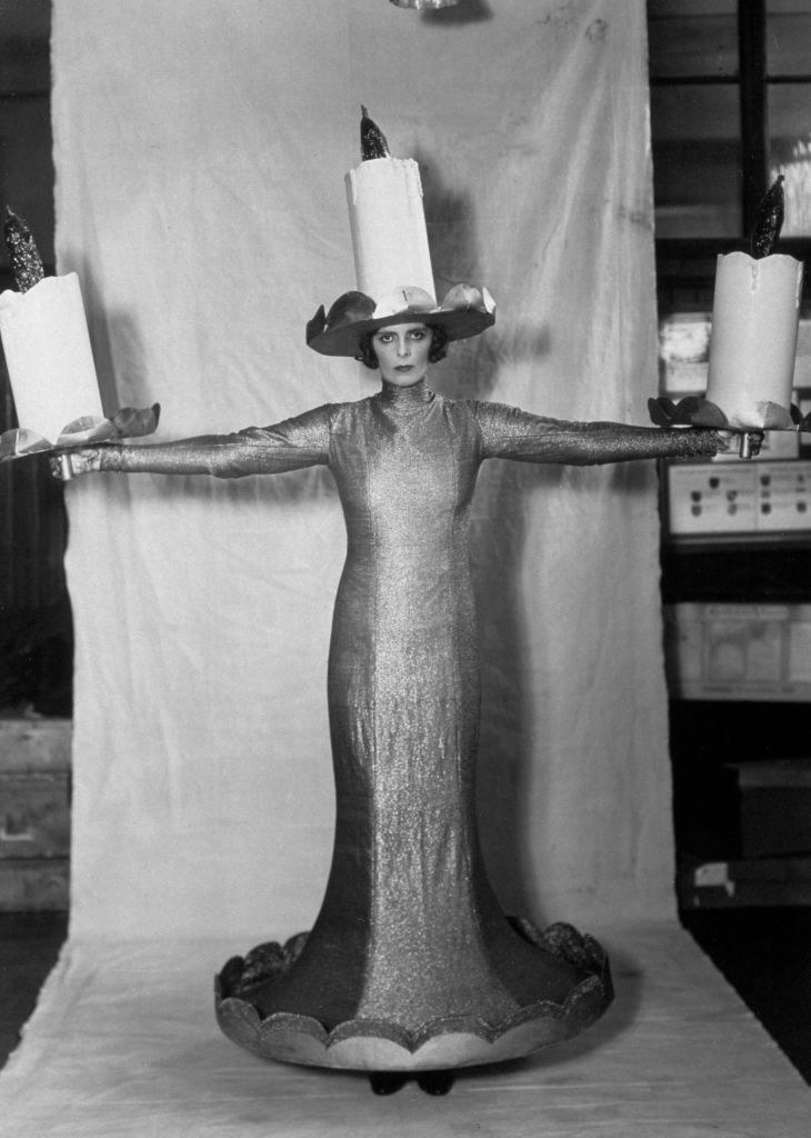 A woman dressed as a candle