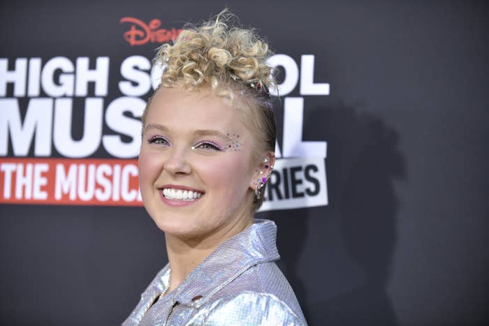 A closeup of JoJo smiling at a red carpet event