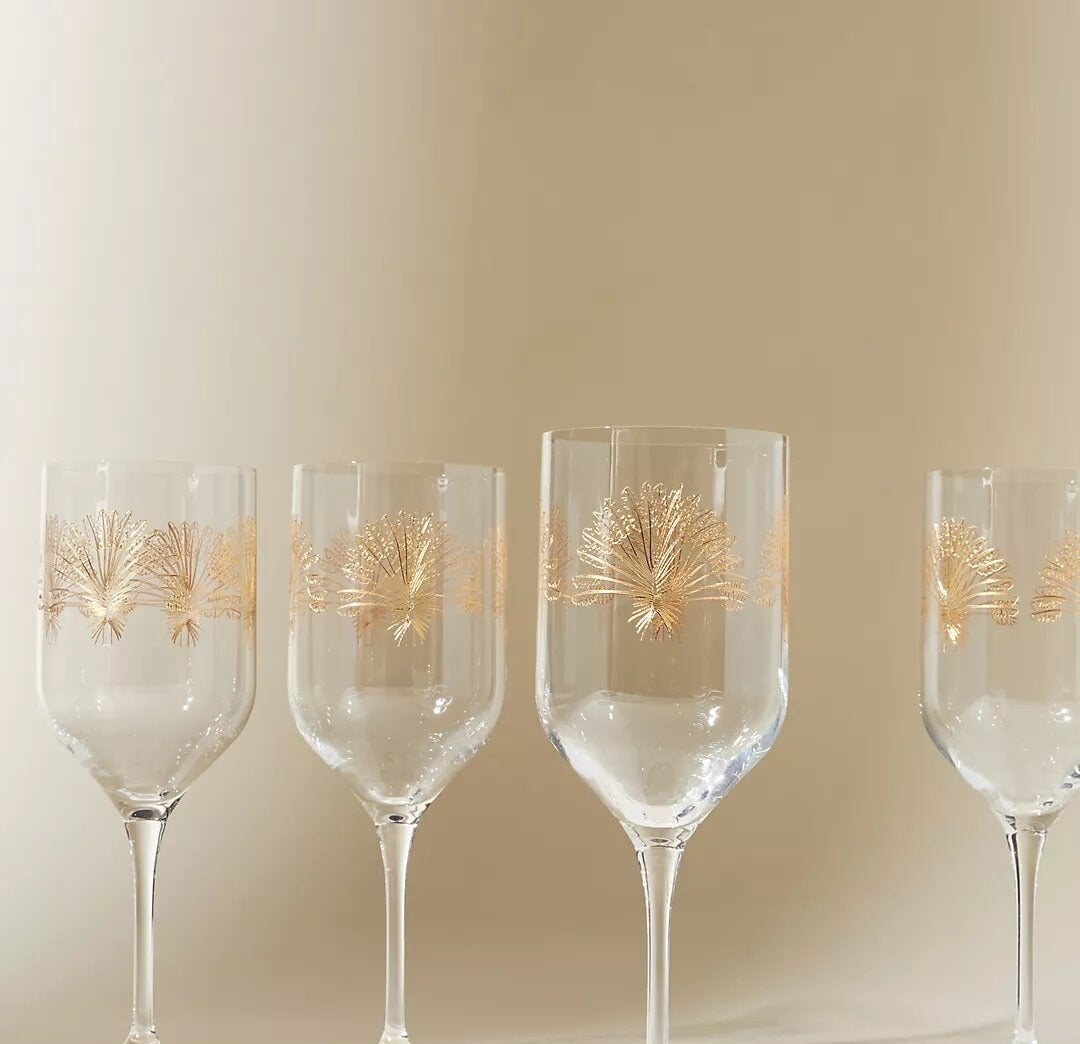 four of the wine glasses on a plain surface