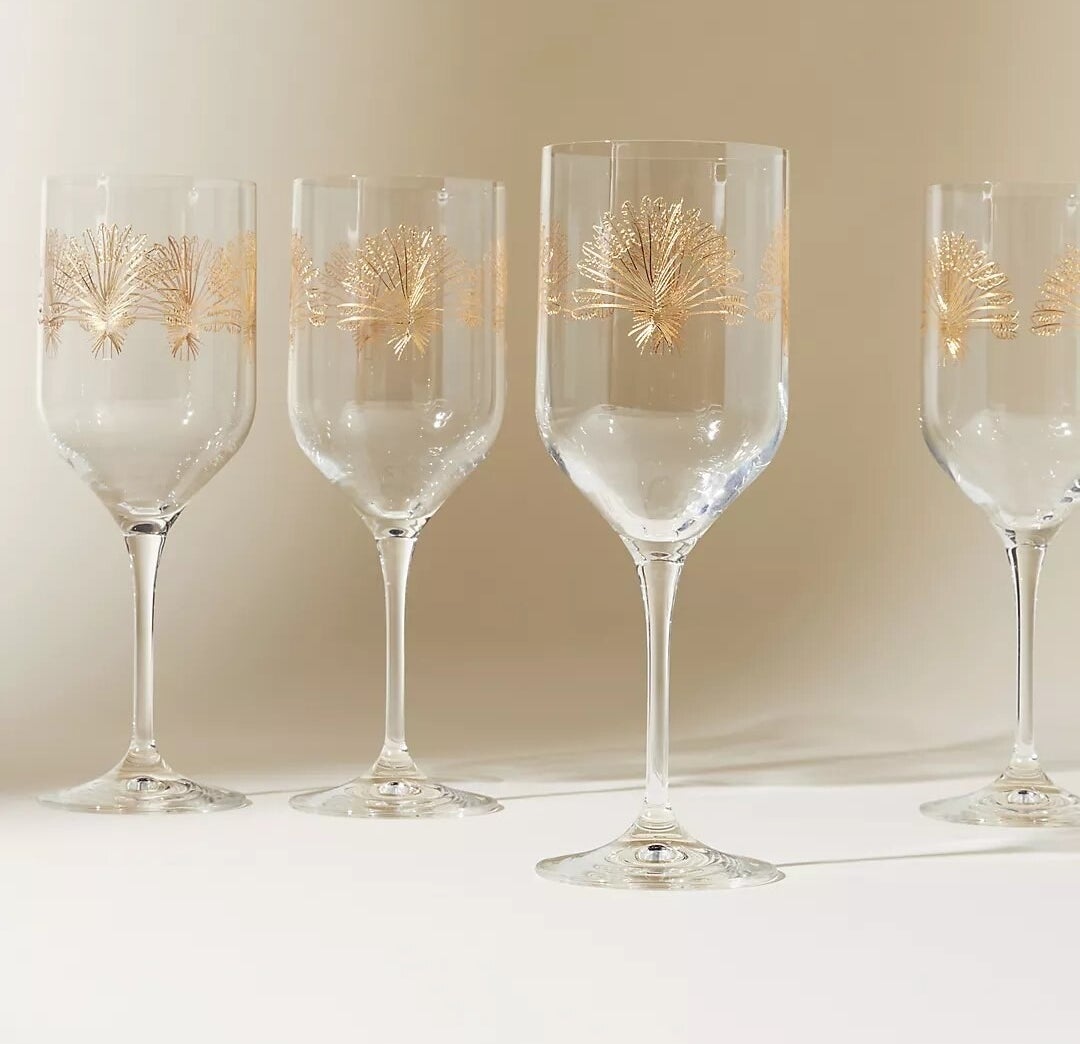 four of the wine glasses on a plain surface