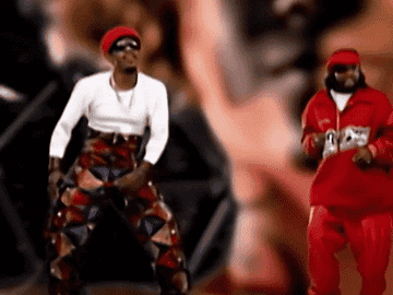 André 3000 and Big Boi dancing in front of a green screen