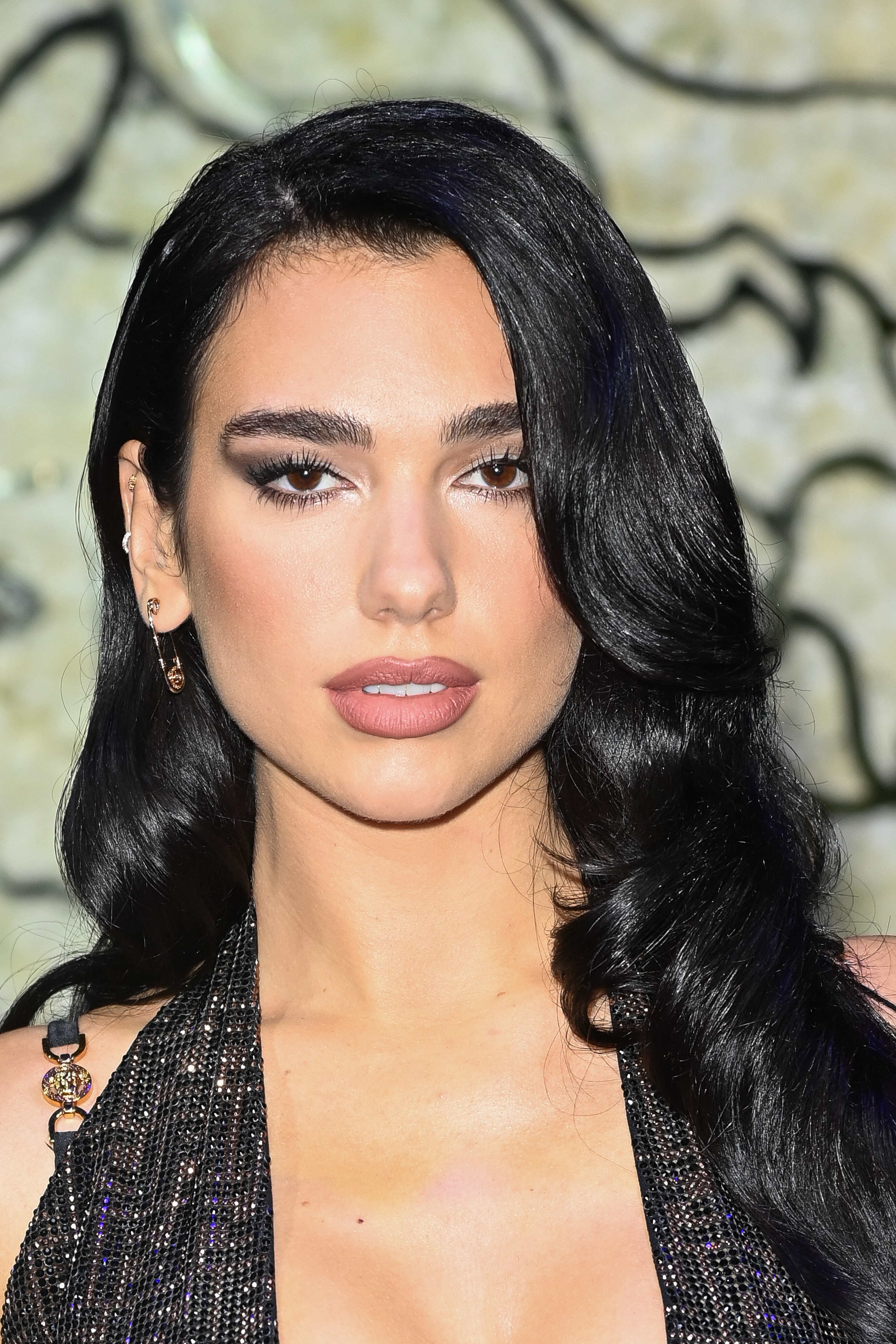 Close-up of Dua in a sparkly halter top