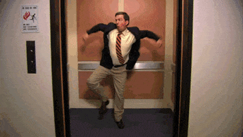 Andy from &quot;The Office&quot; doing an excited, energetic jig in the elevator as doors close