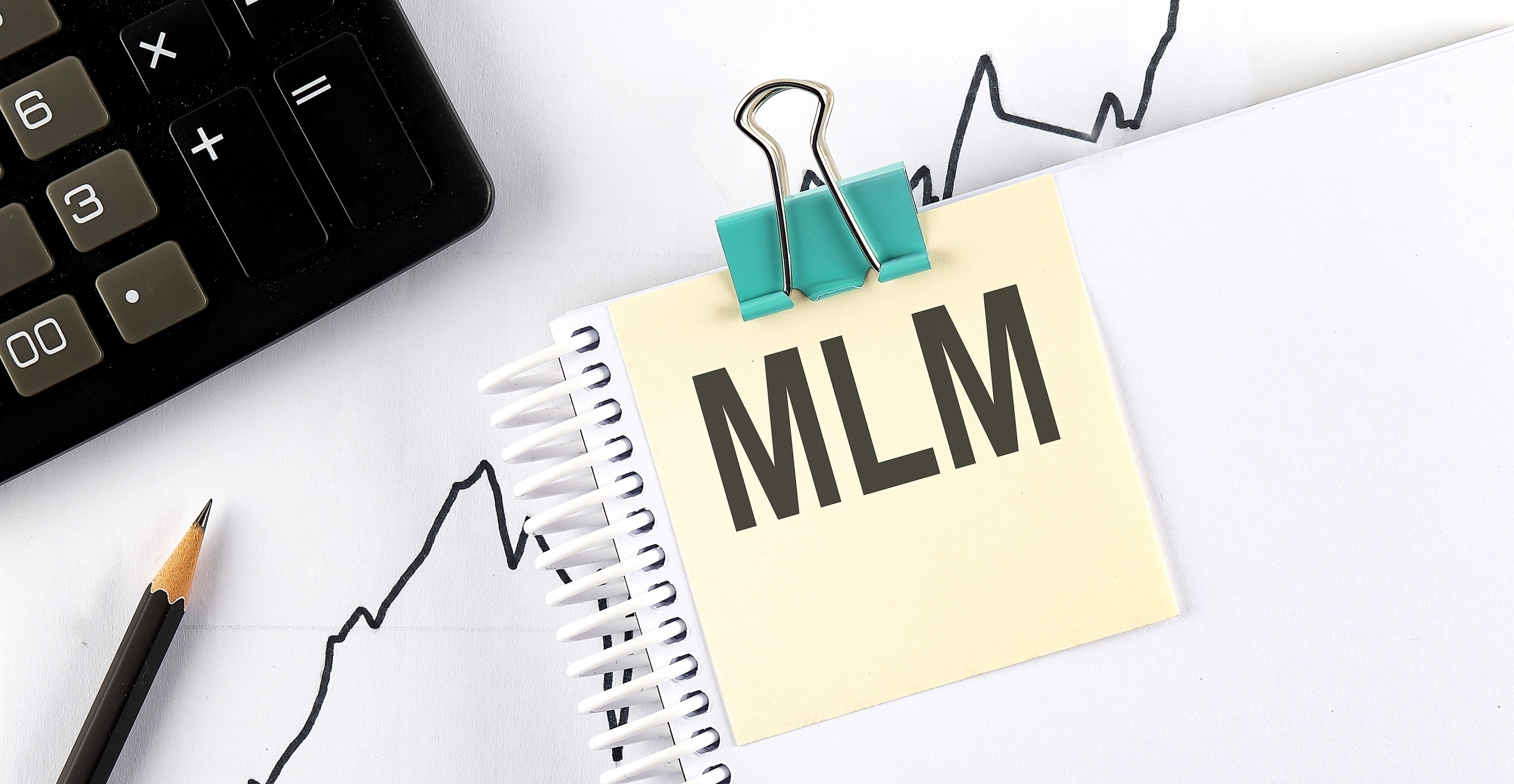 MLM written on a posted note