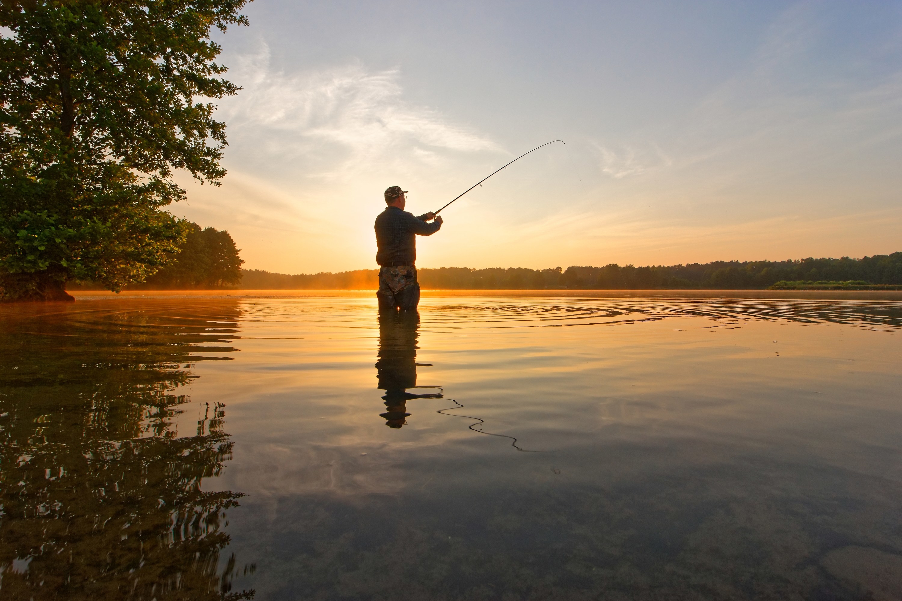 a man fishing in the lake