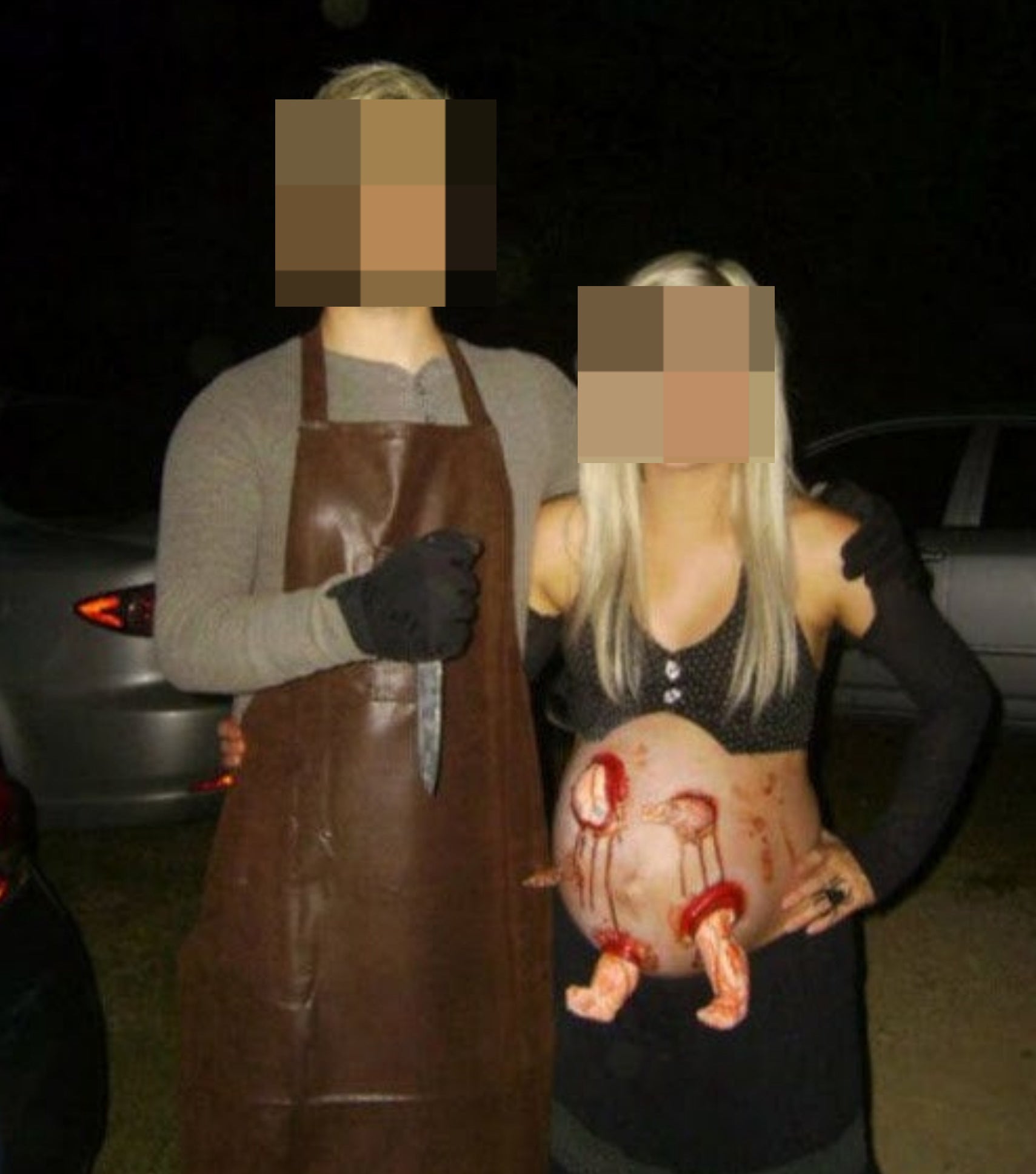 A graphic couples costume in which one partner is holding a bloody knife, and the other is a pregnant woman with bloody baby limbs protruding from her stomach